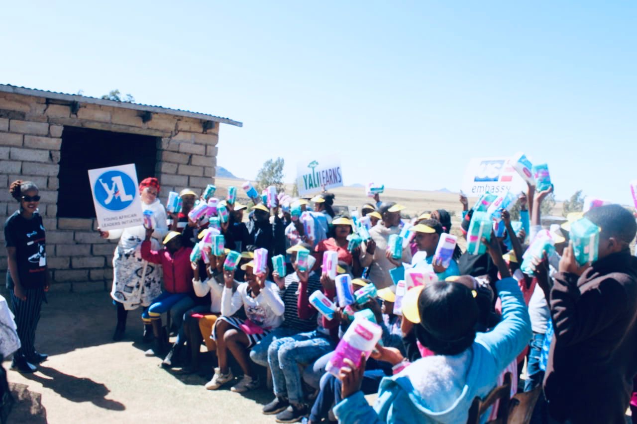 Community members receiving menstrual health supplies
